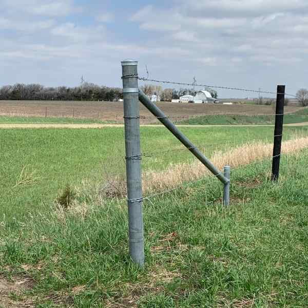 Kicker brace installed using a single brace (N brace) kit. If you are looking to build a fence, shop bulletfence.com for safe and simple pipe fence brace and rail fence kits.