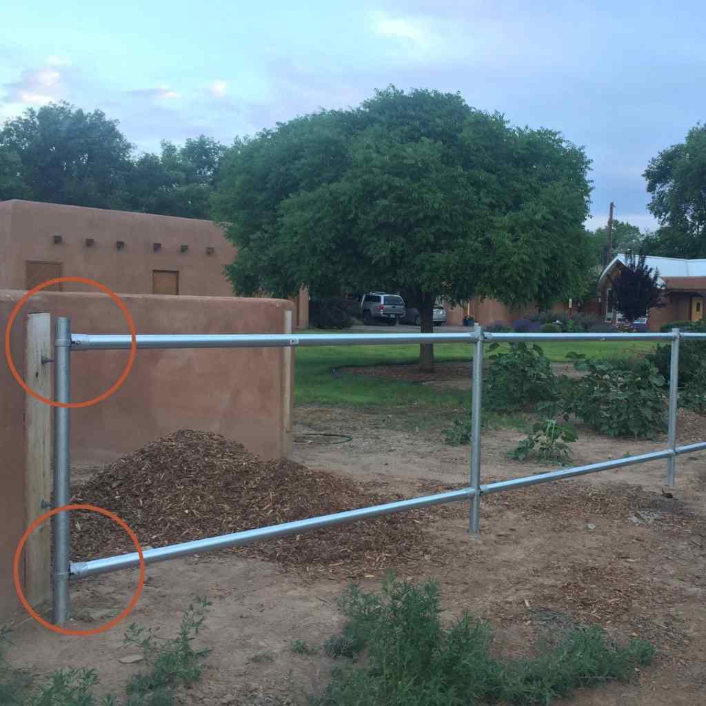 Rail fence terminal kit installed on a two rail pipe fence. Shop bullet fence for your no weld pipe connector kits!