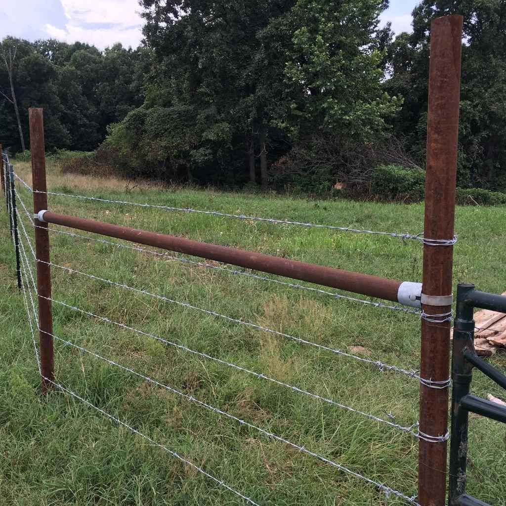 Photo of H fence brace installed using Bullet Fence Systems and wire. Bullet Fence Systems can be used with post sizes ranging from 2 3/8&quot; pipe to 4 1/2&quot; pipe with 2 3/8&quot; and 2 /8&quot; rail sizes. Shop bulletfence.com to find your pipe size and fence brace kit needed for your fencing project. 