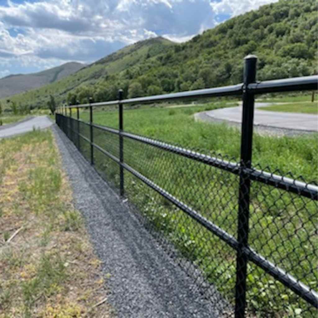 Black powder coated 3 rail pipe fence installed using Bullet Fence Systems. This painted 3 rail fence has wiring on the bottom two rails providing a minimally obstructive view of the beautiful surrounding. If you are interested in installing your own painted rail fence, shop fence painted fence kits at bulletfence.com