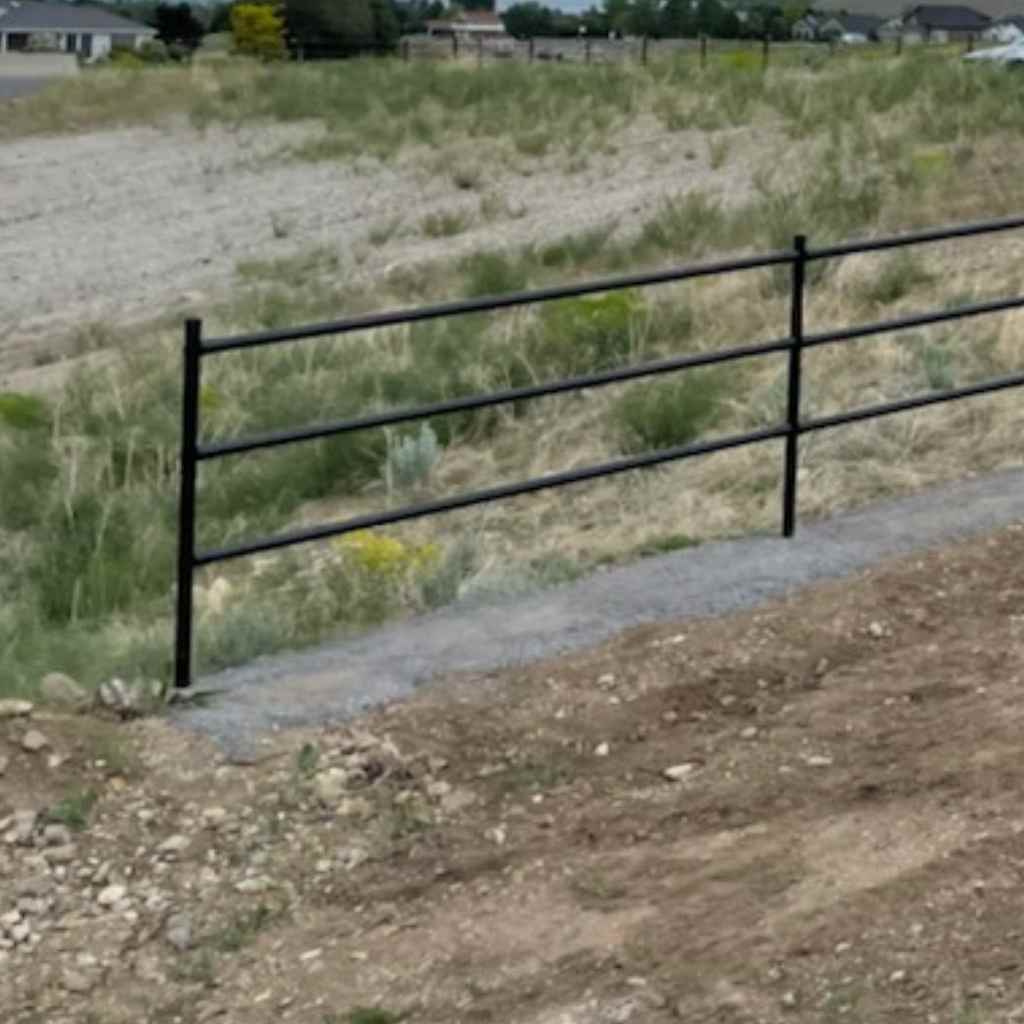 Close up of a rail terminal fence kit installed. These rail terminal kits use one-way bands to cap off the ends of fences for a clean look. Bullet Fence Systems provides rail fence kits as well. Complete your whole pipe fencing project today with Bullet Fence. 