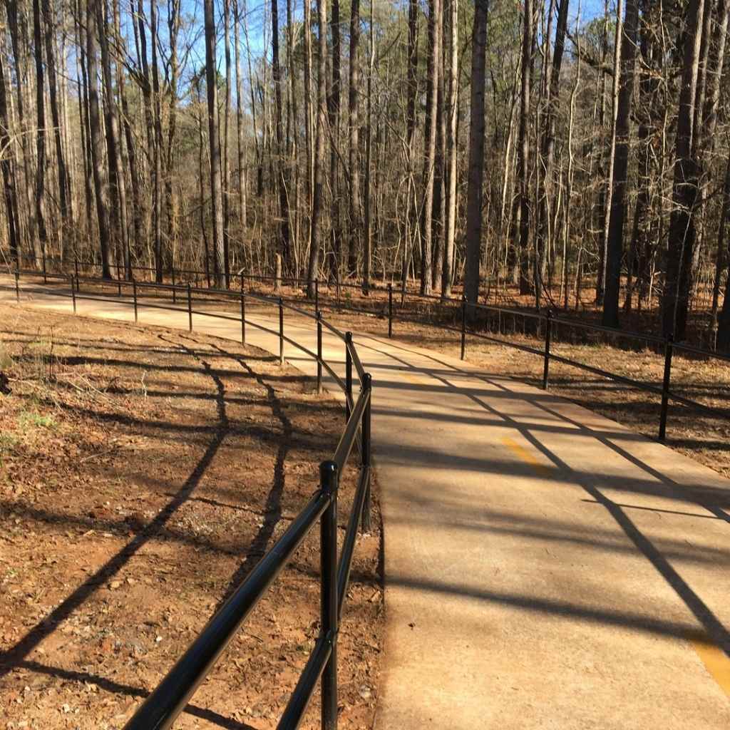 Bullet Fence Systems can be used for a variety of rail fencing projects. This is a photo of a painted two rail fence installed at a park system in Georgia. 
