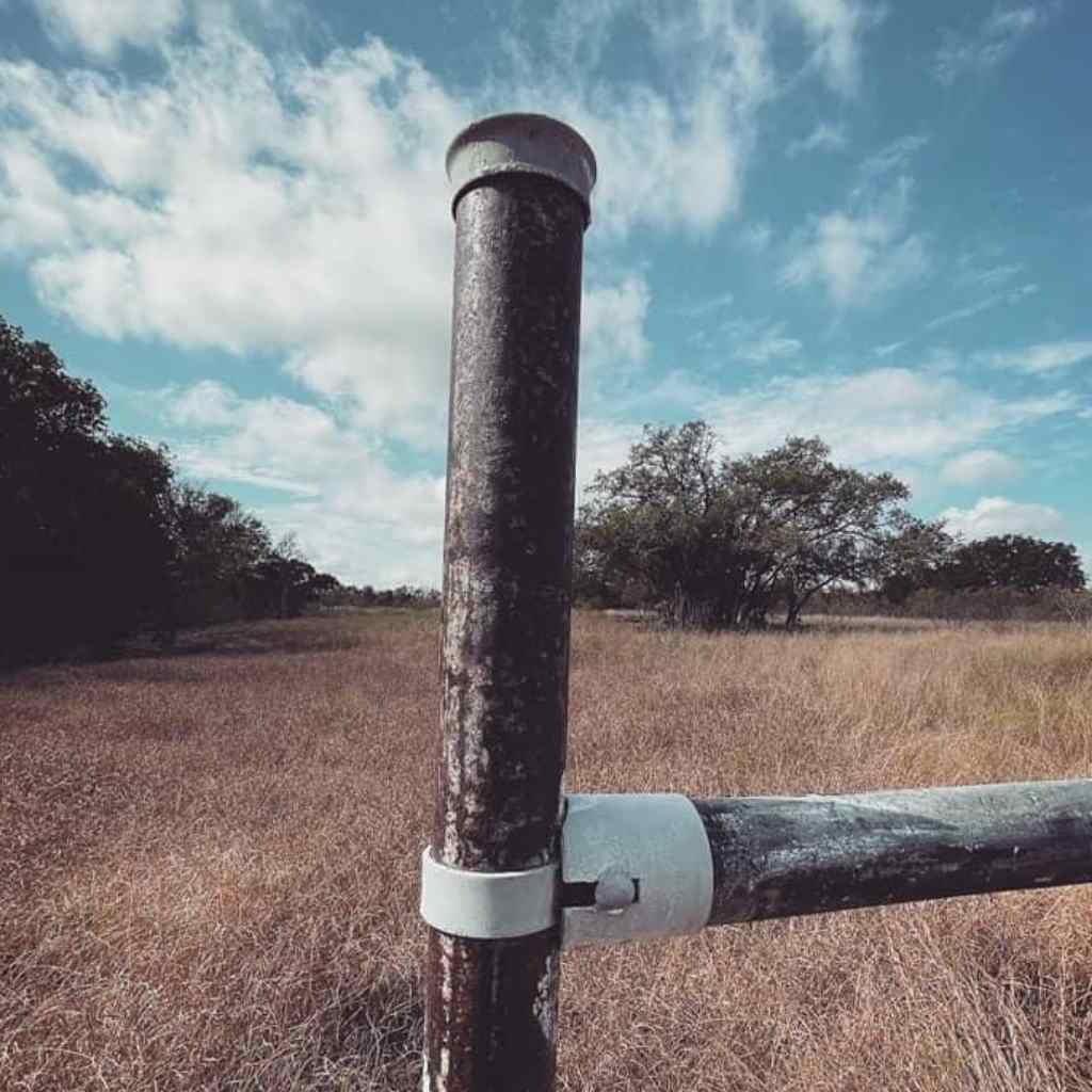 Picture of post cap bought from Bullet Fence Systems. Also photo&#39;d include a Fence Bullet utilized for building a fence brace or rail fence without a welder. 