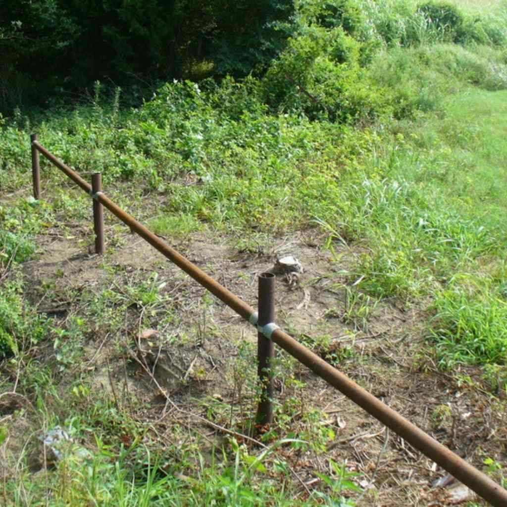 Photo of low pipe rail fence installed using Bullet Fence Systems no weld pipe connectors. 