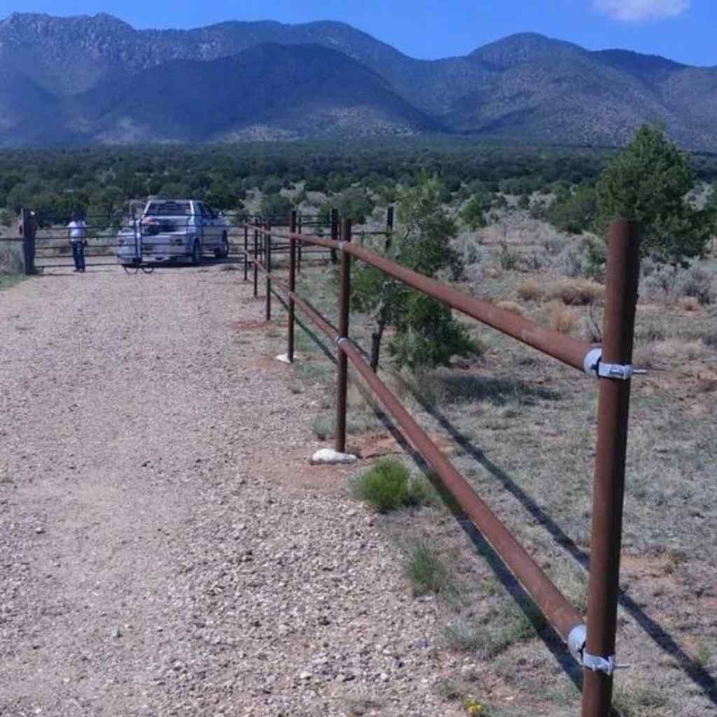 two rail pipe fence built using pipe and bullet fence systems rail fence kit. 