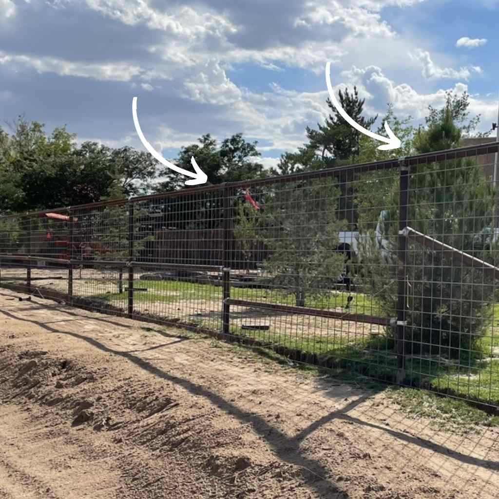 Pipe fence with wire installed using no weld pipe connectors available at Bullet Fence Systems. The top rail is complete using a no weld top rail sleeve connector for 2 3/8 inch OD pipe. 